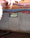 Indiana and Michigan crawl space with vents, showing mold, rot, and fiberglass insulation dripping off the ceiling.