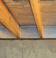 SilverGlo™ insulation installed in a floor joist in Plymouth