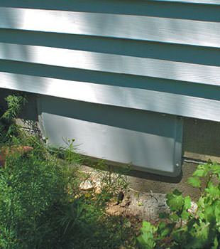 A gray crawl space vent cover in Monticello