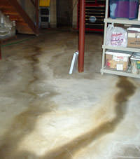 Flooding entering a basement through a floor crack in Nappanee