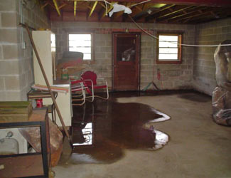 a flooded basement floor in a Middlebury home