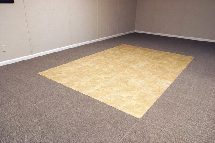 tiled and carpeted basement flooring installed in a Mishawaka home