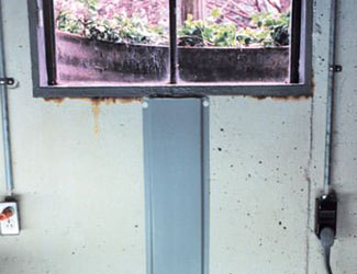 Repaired waterproofed basement window leak in Goshen