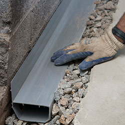 installing a drain tile system in a Rensselaer home